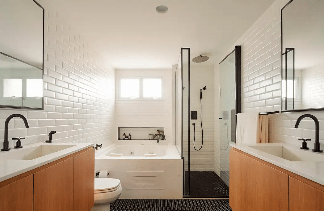 Modern Bathroom Designed with Dark Floors and Warm Wood Surfaces