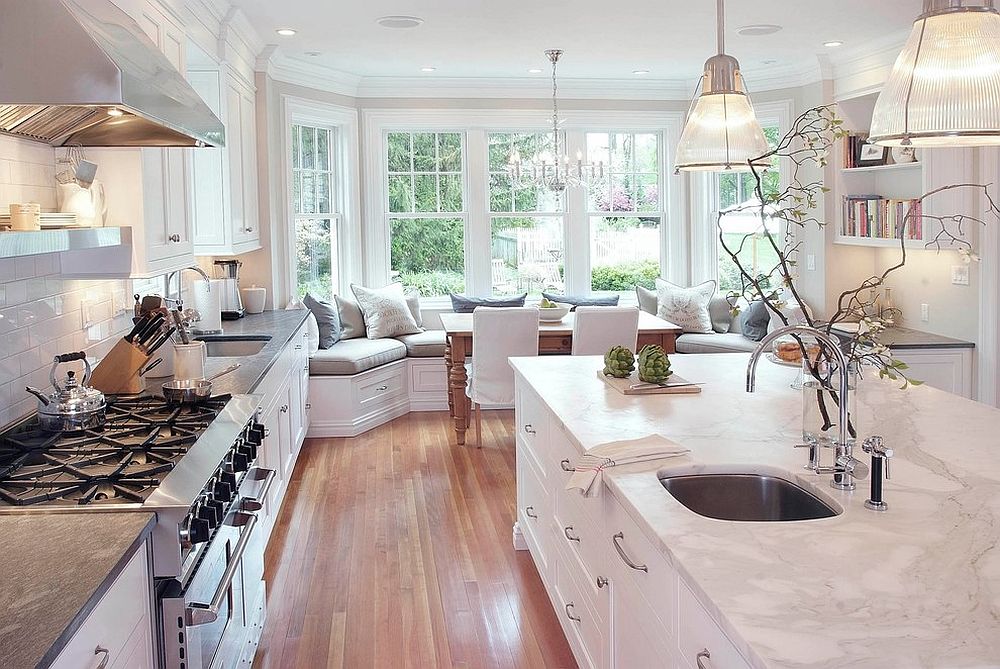 Spacious modern kitchen in white with comfy window seating