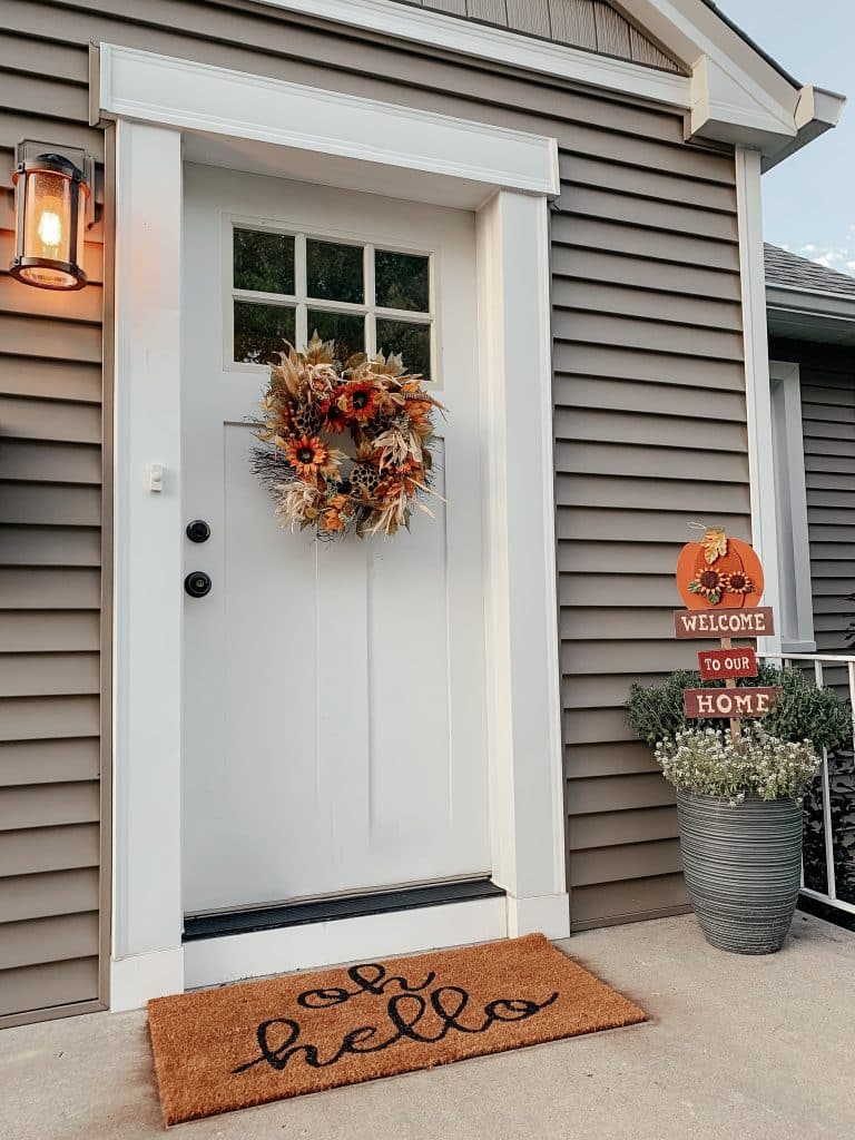 Welcome Doormat With a Fall Wreath