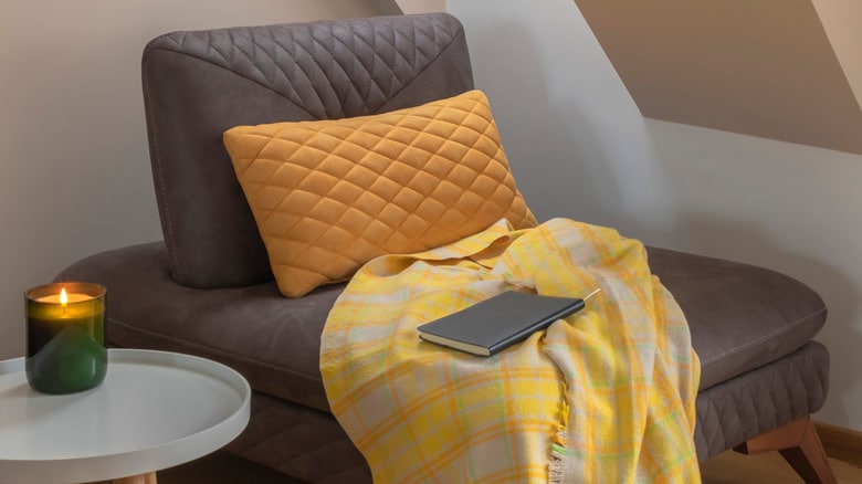 Cozy Nook By The Window With Yellow Blanket And Pillow
