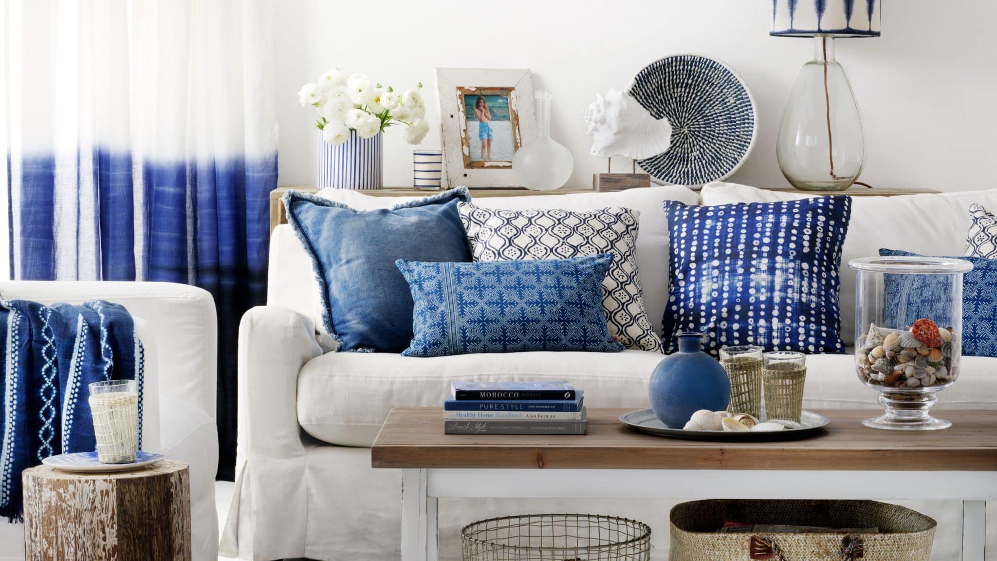 How to style and accessorize a sofa for a coastal-inspired living room?