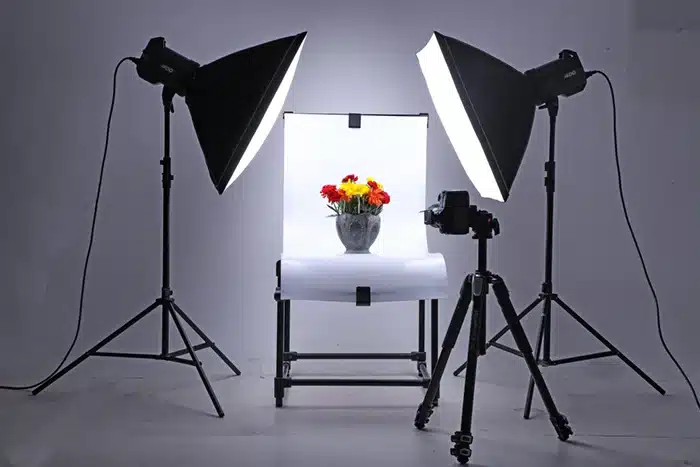 A well-lit photo studio with a chair