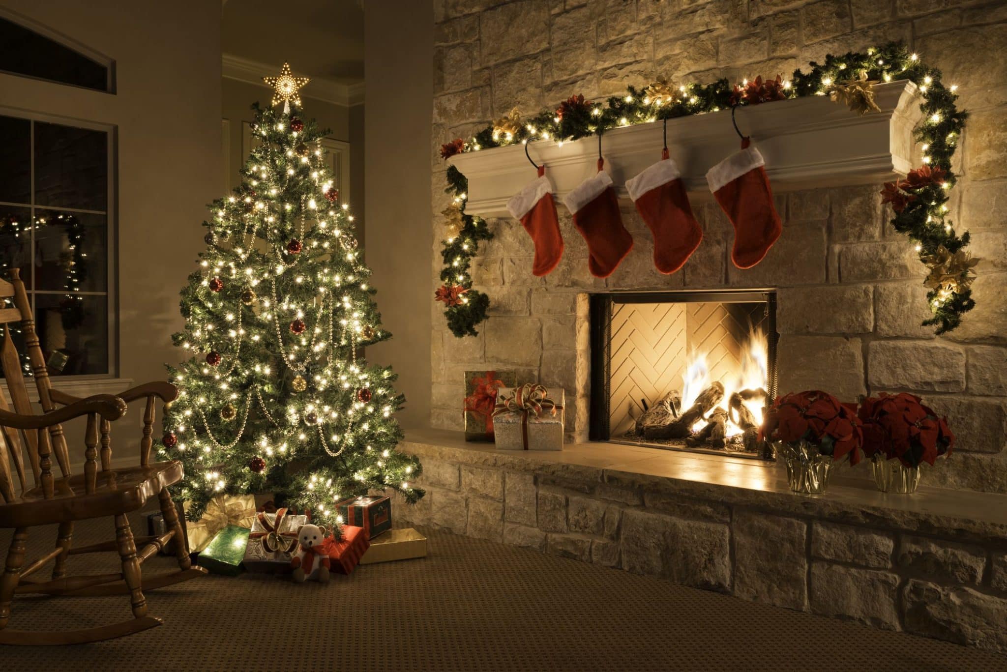 A cozy fireplace adorned with stockings, creating a warm and festive ambiance for Christmas