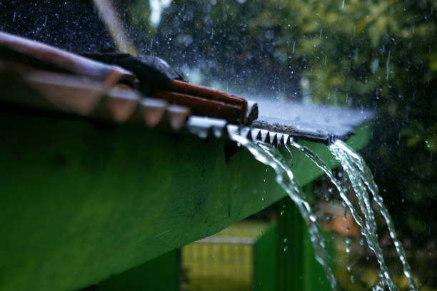 Close up of water flow on the roof during rain - Stock photo