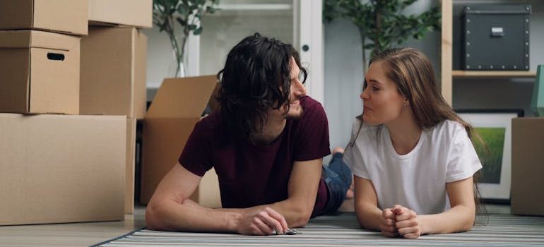 a couple moving and discussing transforming your relocation into a home makeover opportunity