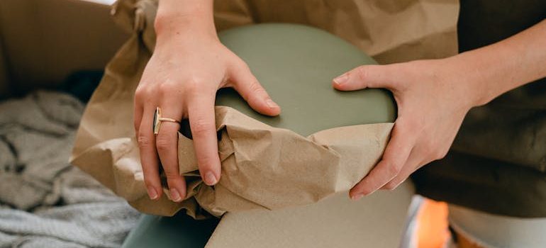 a close-up of a person unpacking items