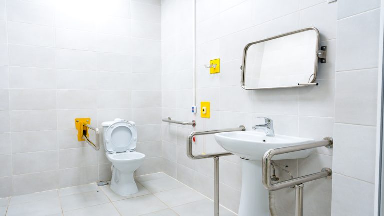 Clean accessibility restroom designed for comfort and convenience in a modern facility