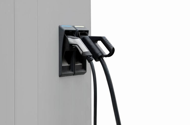Isolated EV charge point with CCS and AC chargers.