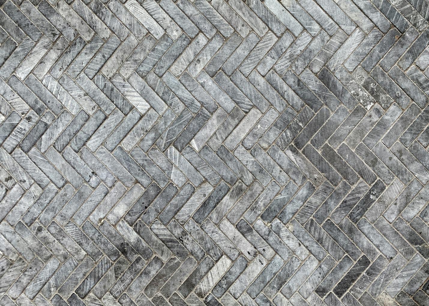 A close-up of a grey brick floor AI-generated content may be incorrect.