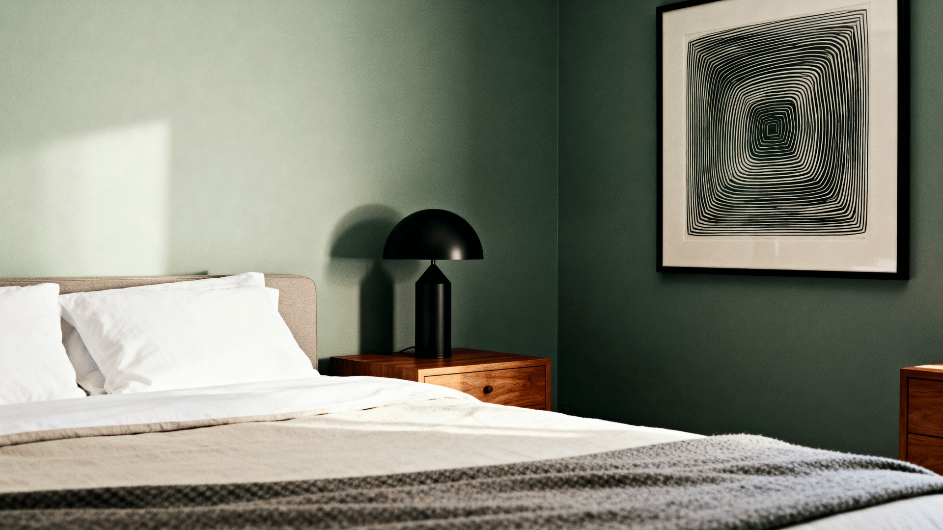 modern sage green bedroom with black accents