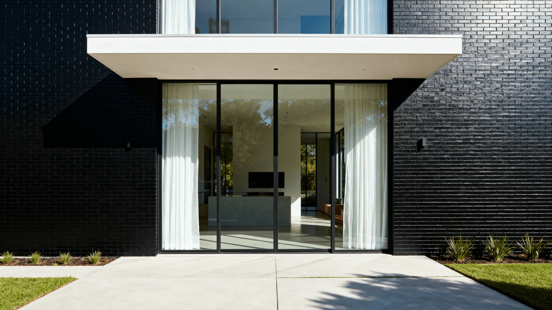 black brick with floor to ceiling windows