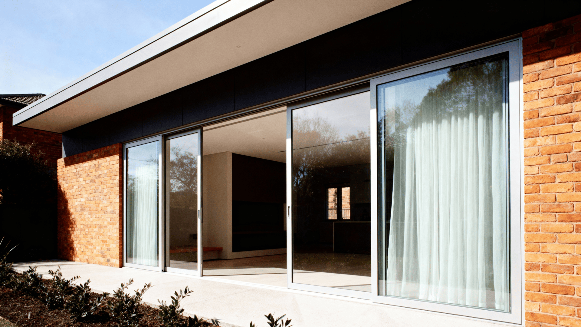 brick and glass modern hybrids