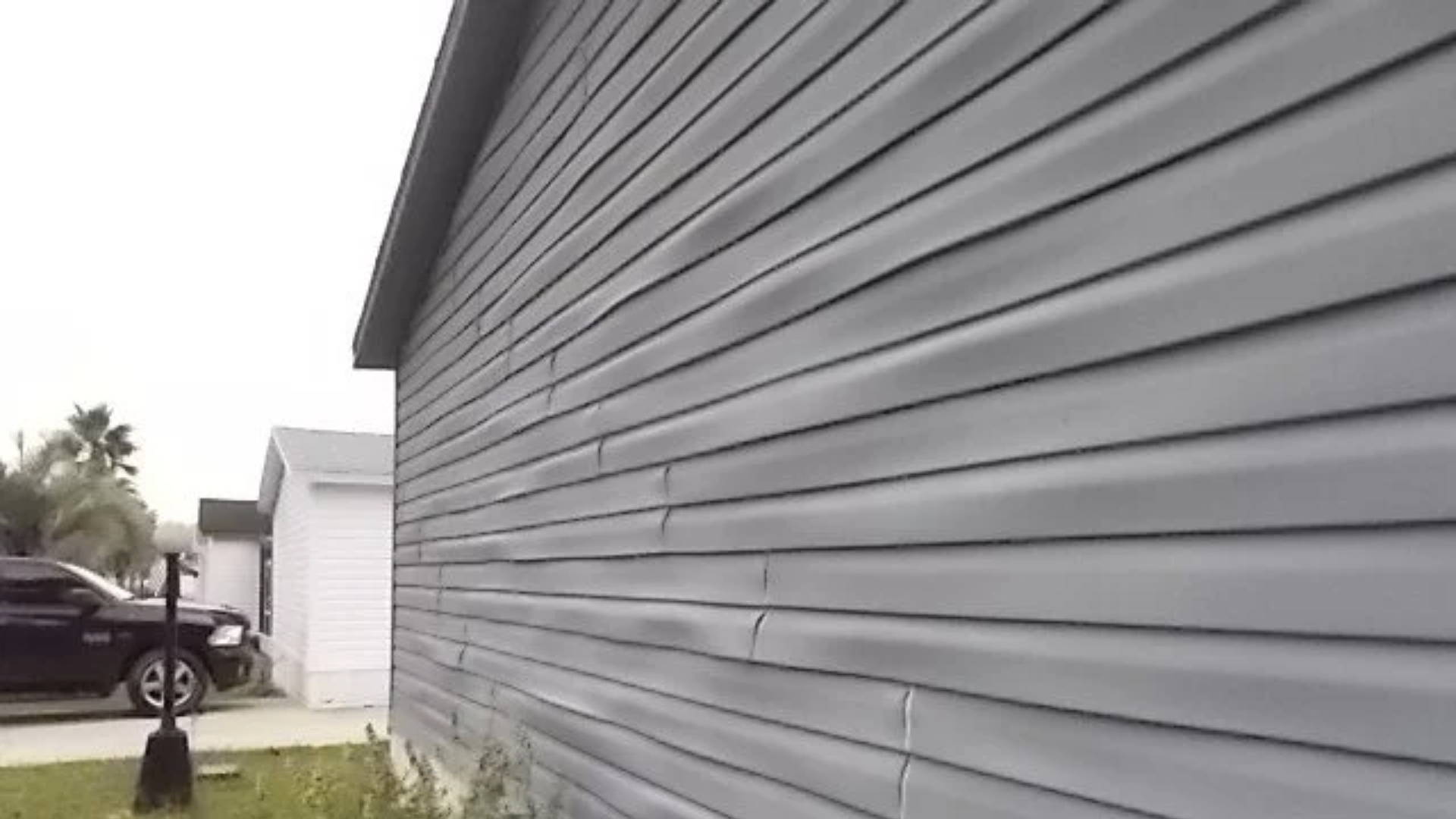 warped vinyl siding needs replacing