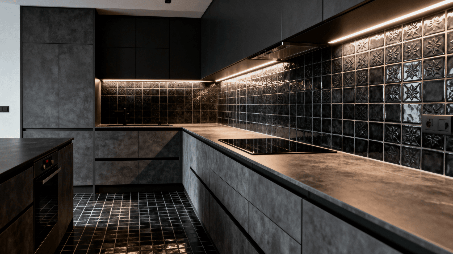 Full kitchen with tile surfaces finished in charcoal grout, creating a seamless moody look that unifies backsplash and flooring.