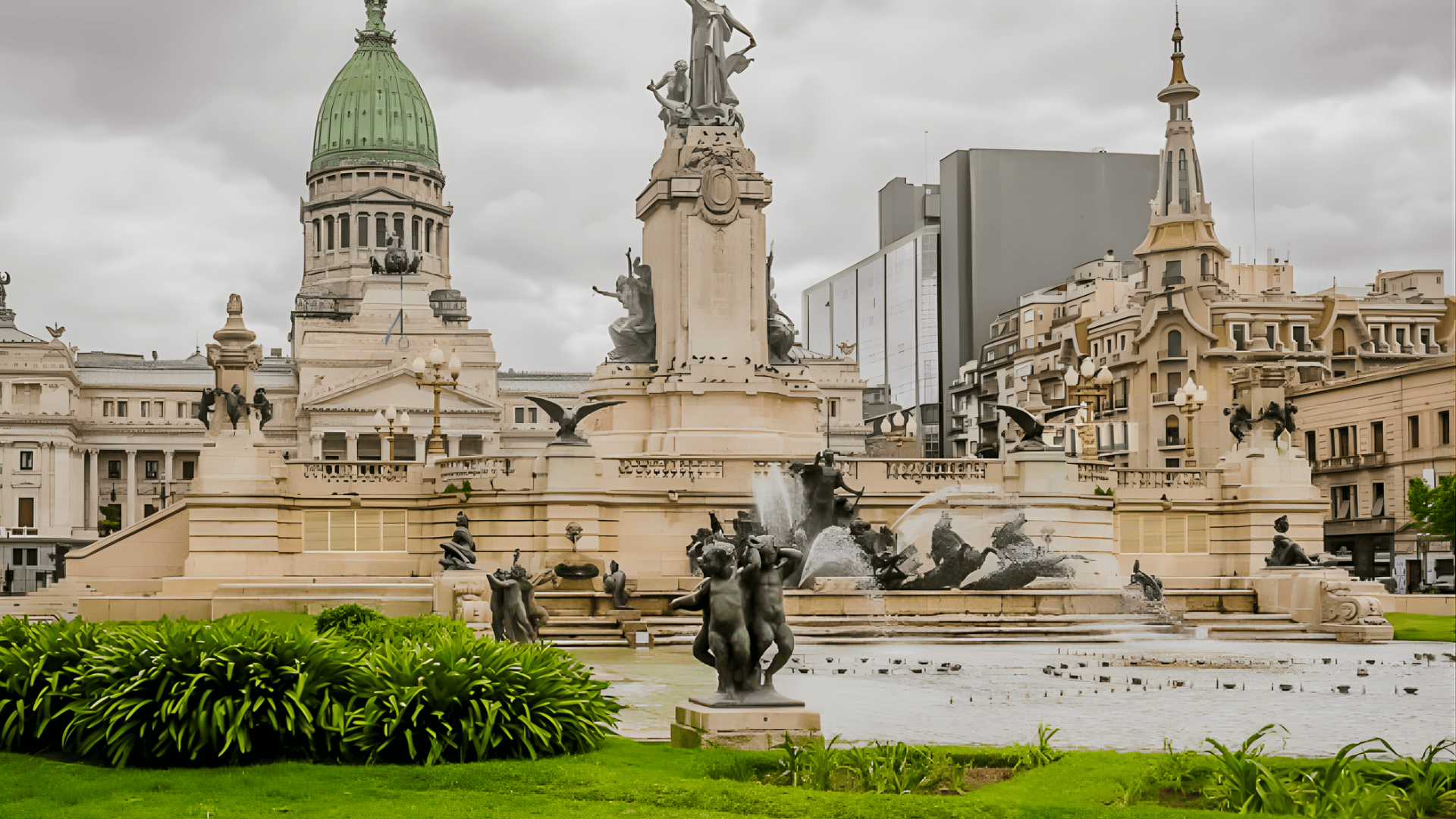 Plaza del Congreso in Buenos Aires with fountains and statues, Argentina’s National Congress building and city skyline under cloudy skies