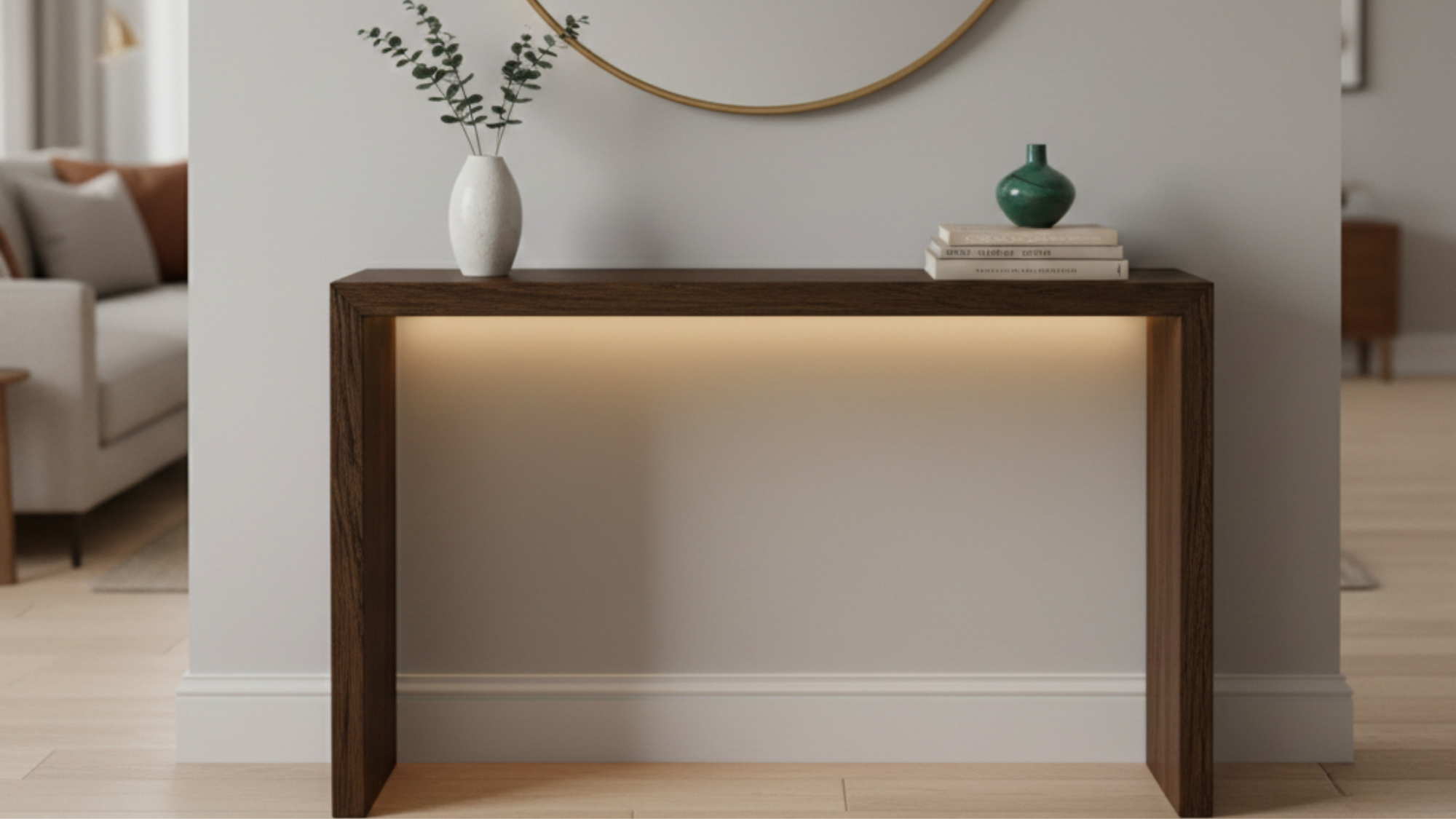 a narrow console table against a wall with decorative items and mirror above