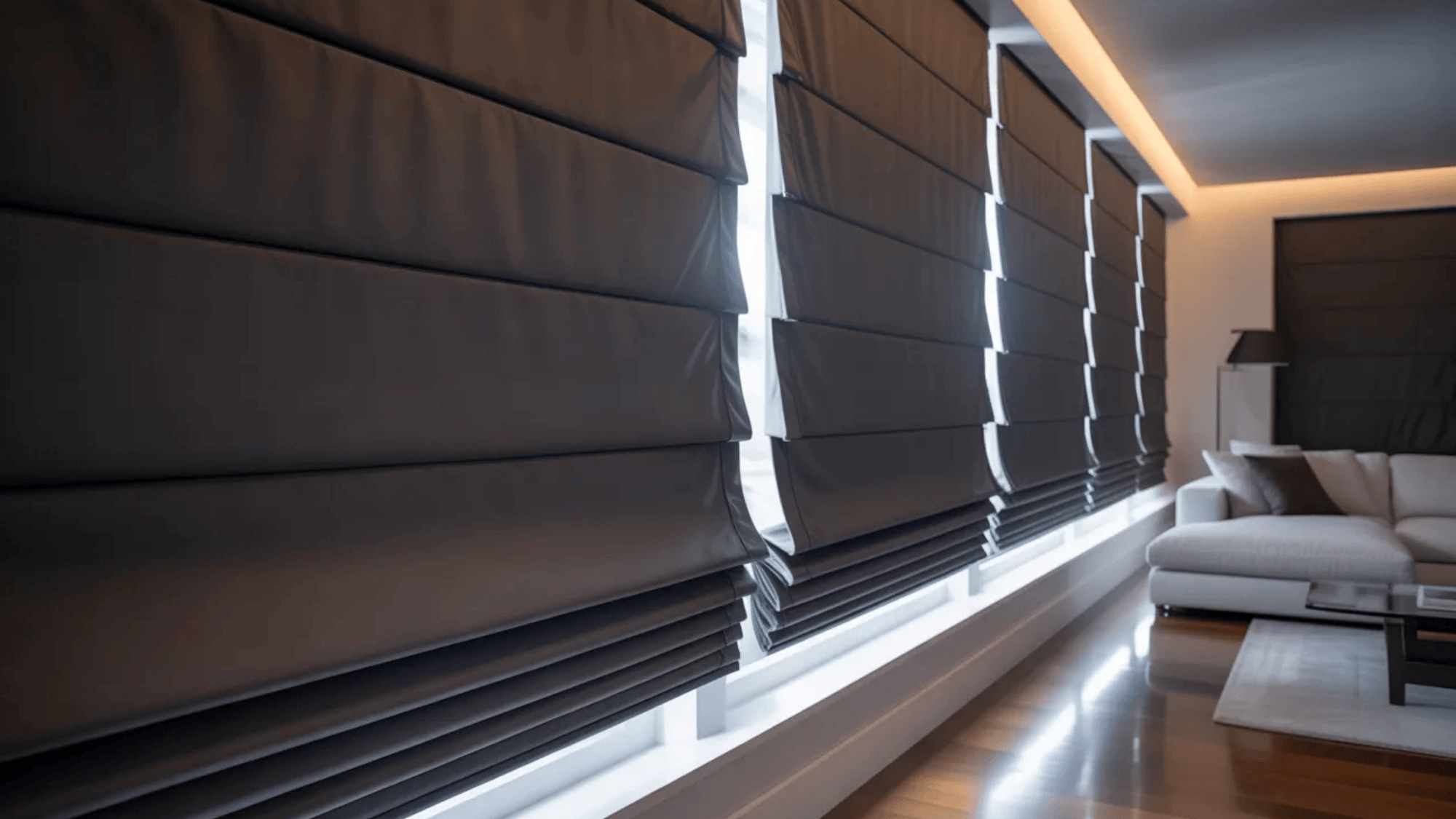 blackout Roman shades in a modern living room, offering complete light blockage and privacy with a sleek, structured design