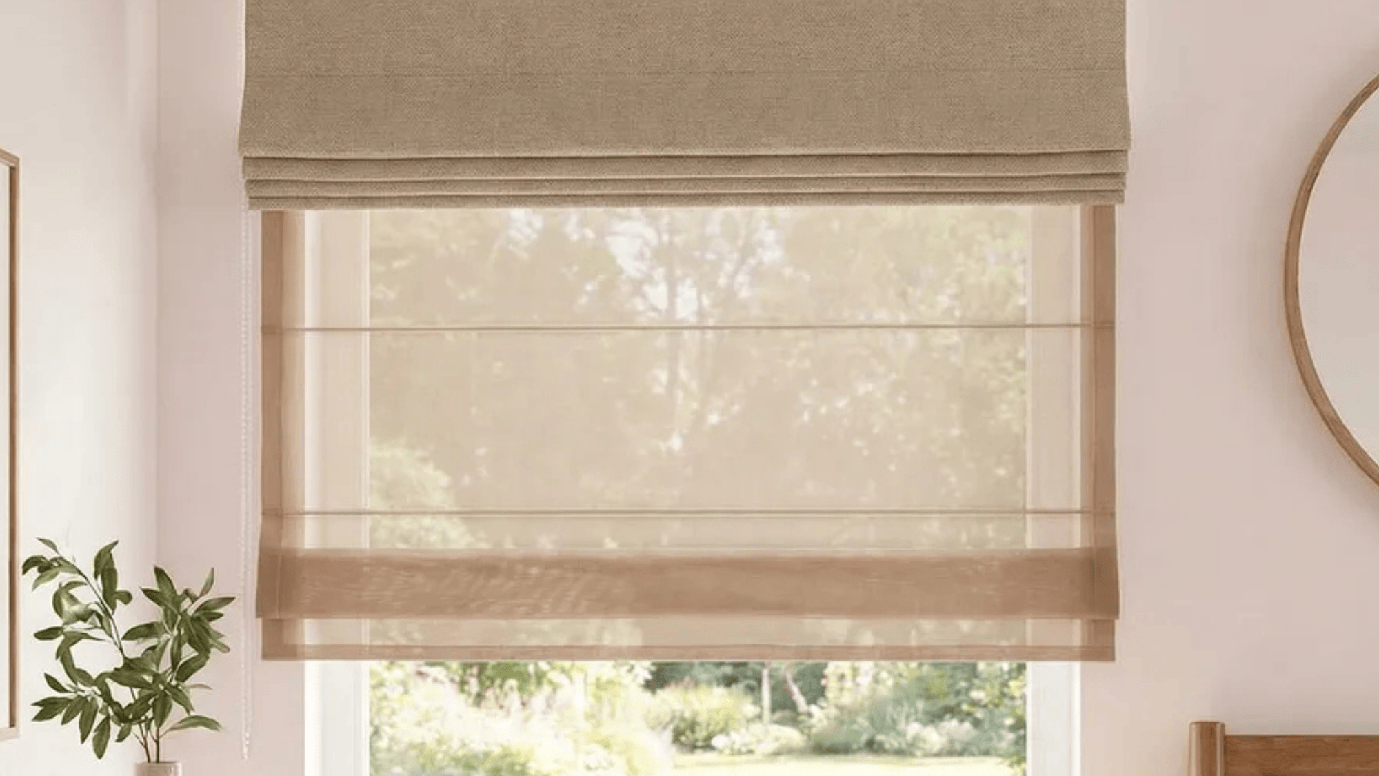 double Roman shades featuring two layers of fabric for enhanced light control and privacy, with a sleek, modern design