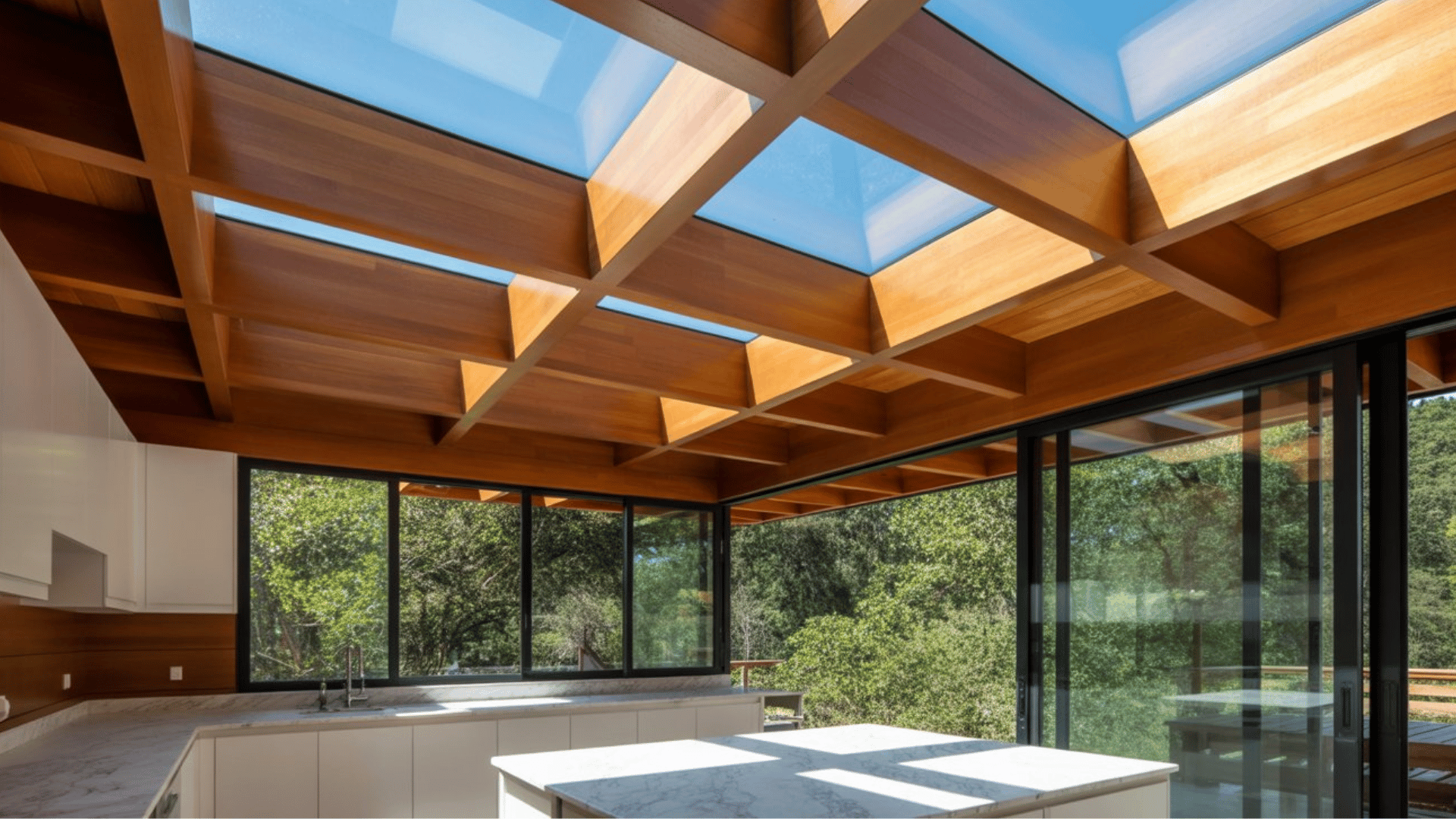 elegant room with a limewashed wood ceiling, muted tones, neutral sofas, a rustic wood coffee table, and soft lighting.
