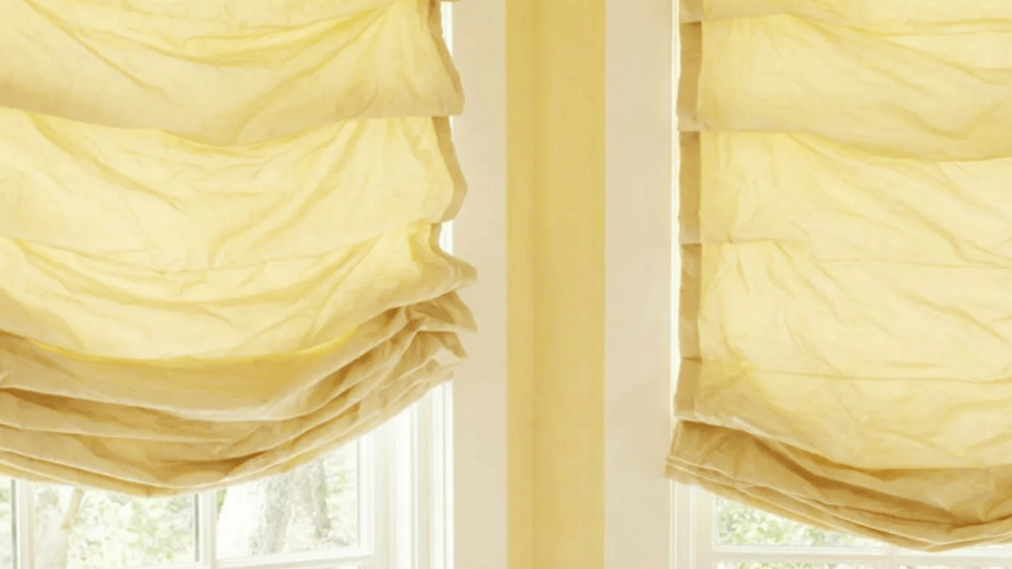 hobbler Roman shades with soft, loose folds creating a relaxed, casual look, adding warmth and texture to the window