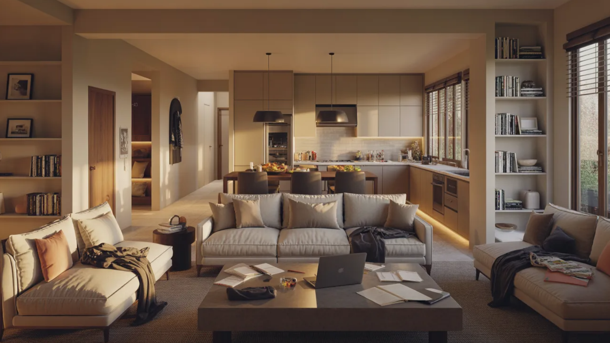 open-concept living area with a cozy keeping room setup, featuring neutral sofas and a coffee table with a laptop and papers, seamlessly connected to a modern kitchen and dining space in the backg