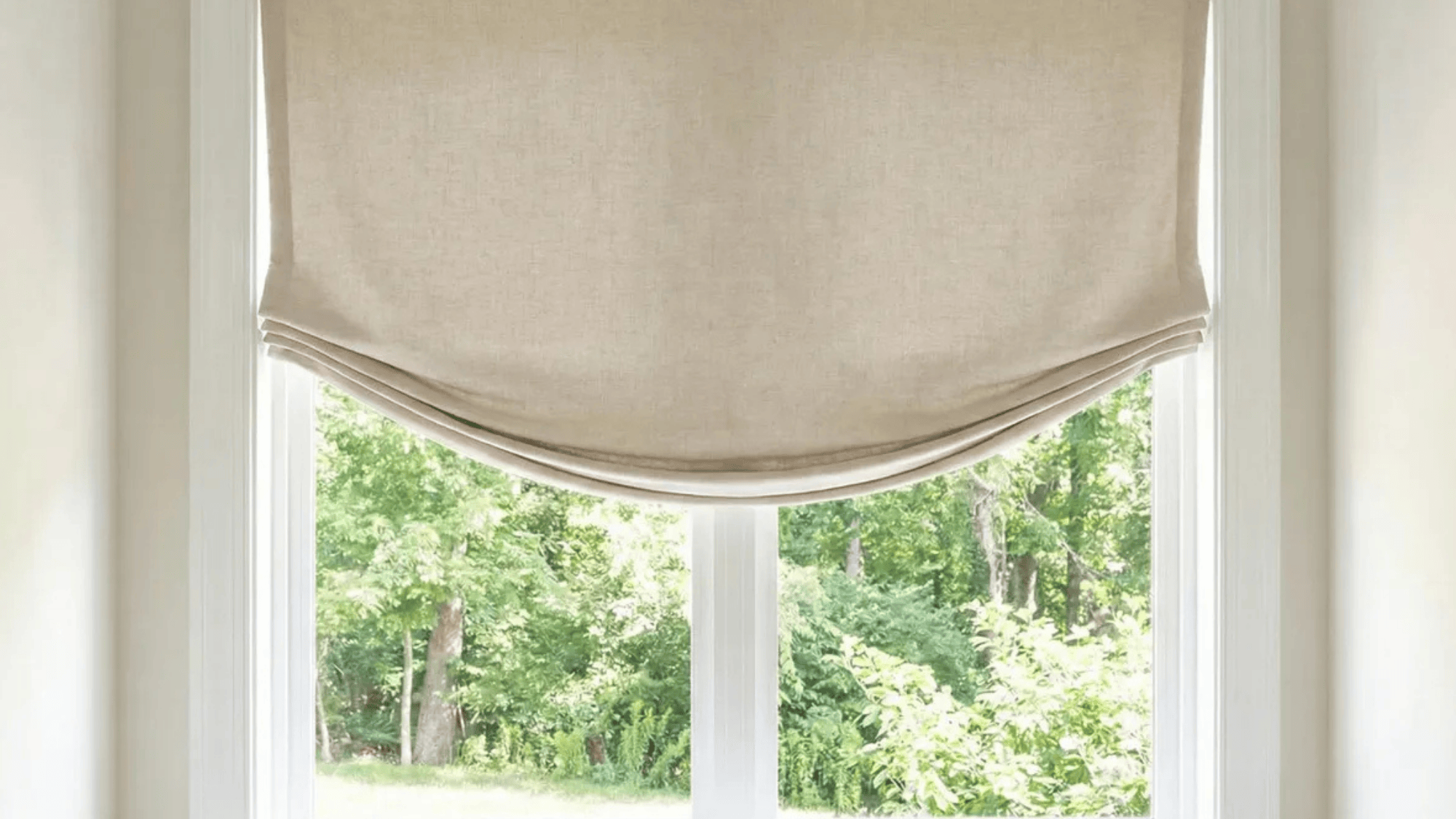 relaxed Roman shade with soft, unstructured folds, creating a casual, inviting look in a window