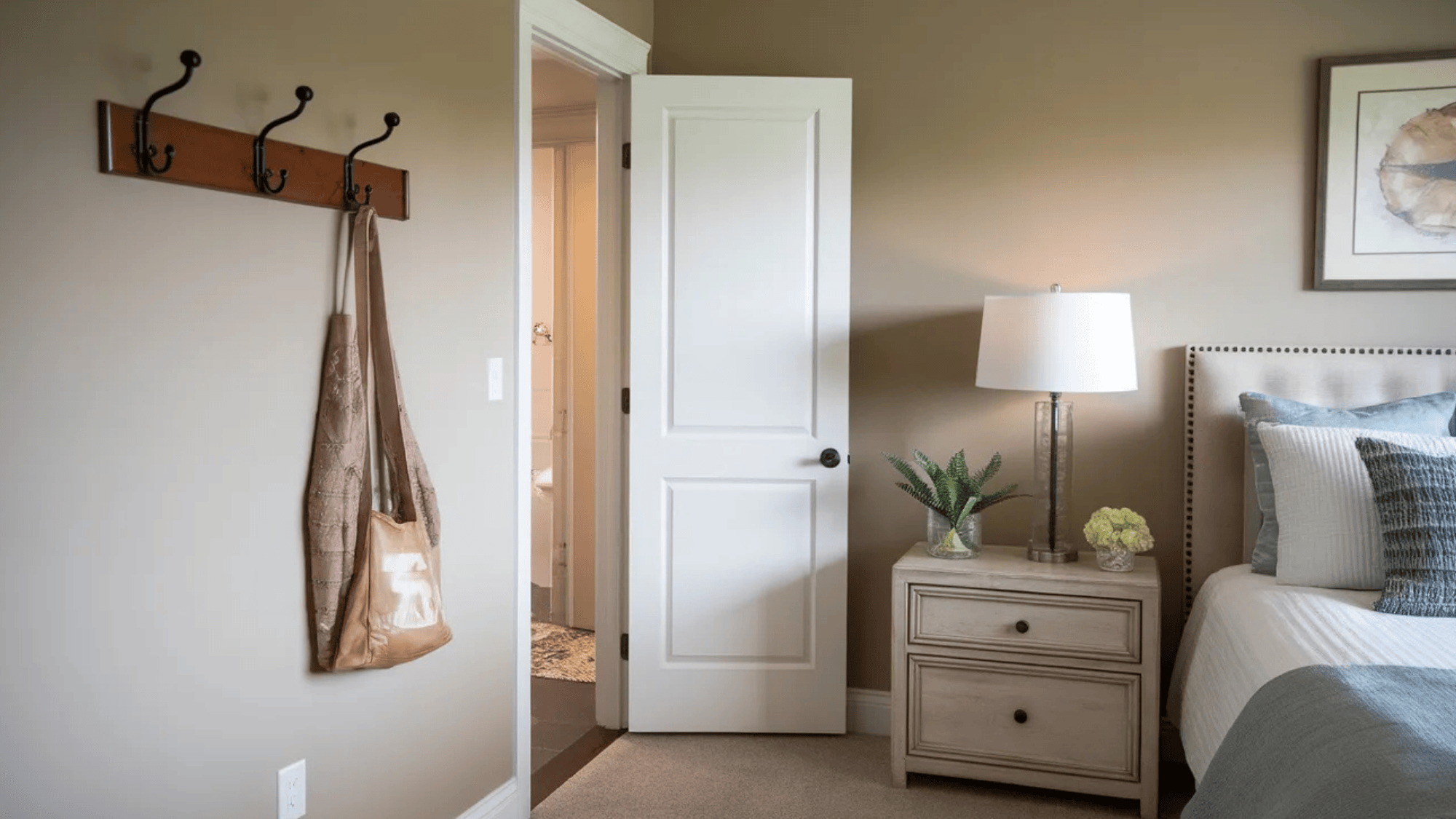 wooden wall hooks for hanging bags and accessories in a guest bedroom