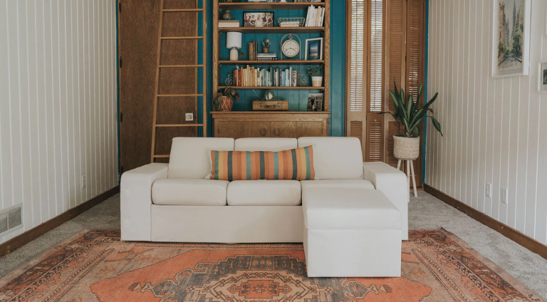 Cozy living room with teal shelves.