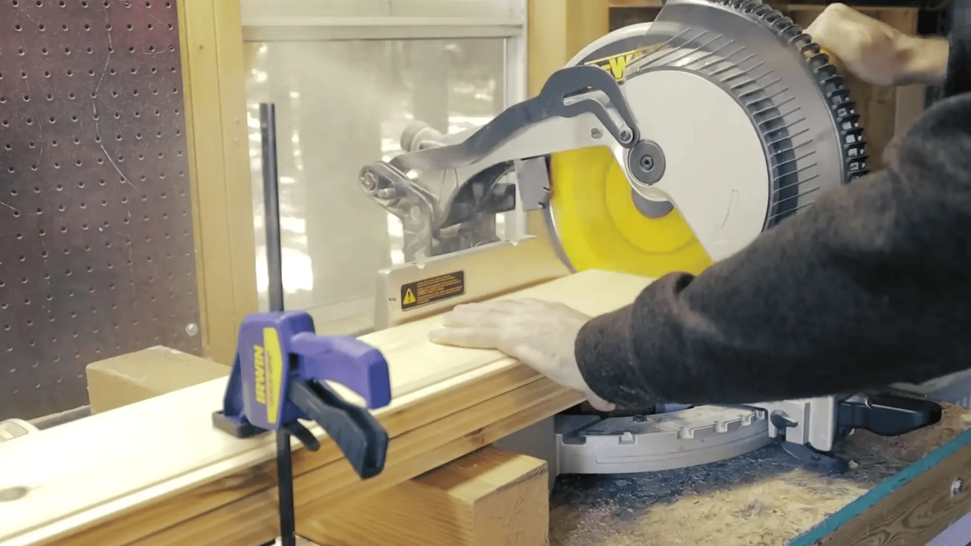 Cutting tongue-and-groove boards and side boards to the required height for the barn door.