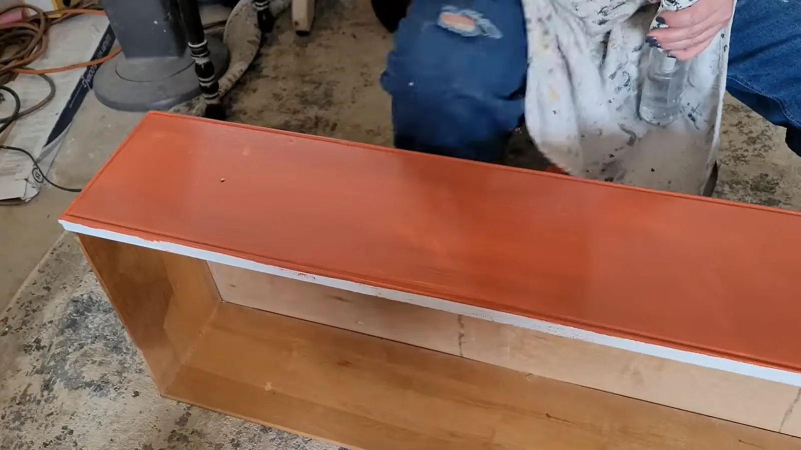 Dresser body painted in a warm rust-colored base coat while the top remains natural wood.
