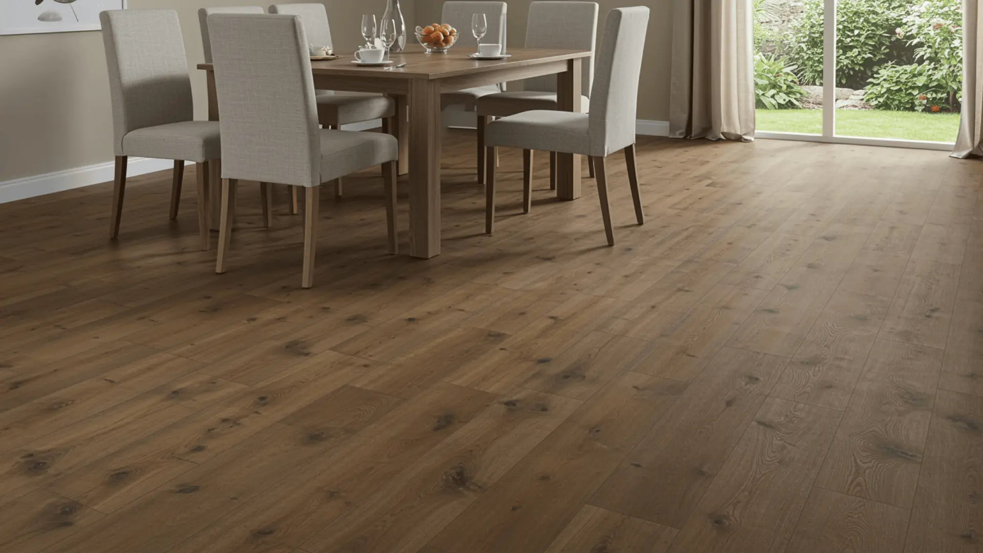 Laminate flooring in a dining room beneath a table and chairs with wood-look plank surface