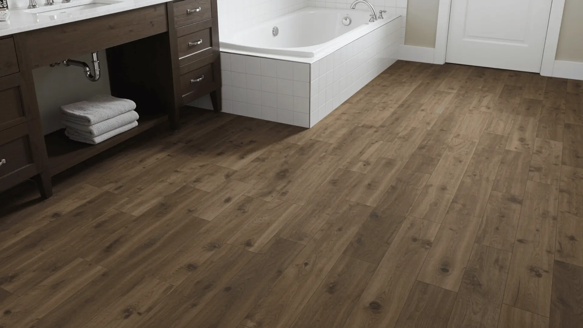 Luxury vinyl plank flooring installed in a bathroom with wood-look plank surfaceLuxury vinyl plank flooring installed in a bathroom with wood-look plank surface