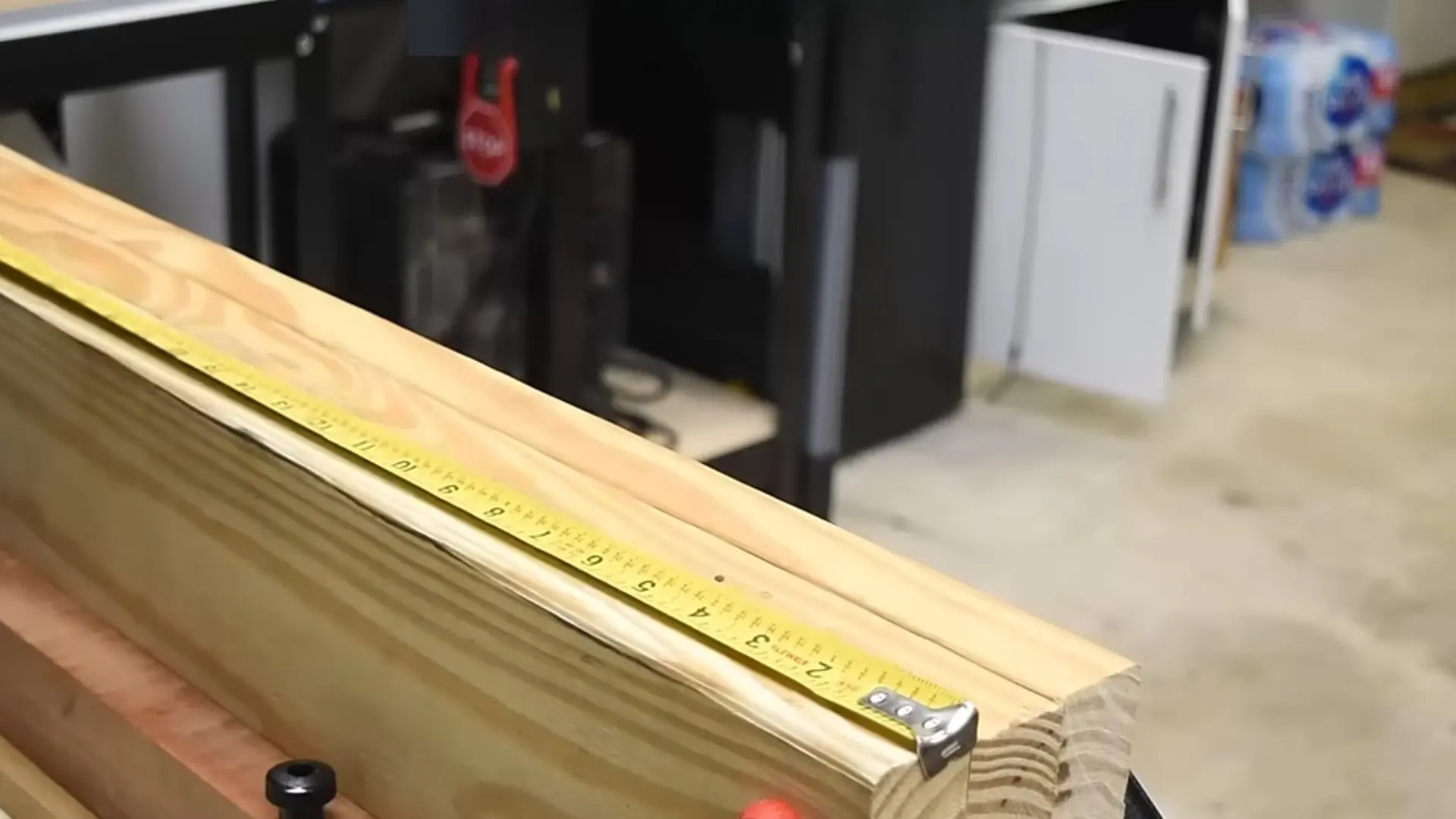 Wooden dowel rod marked for cutting with several short dowel pieces placed on a workbench.