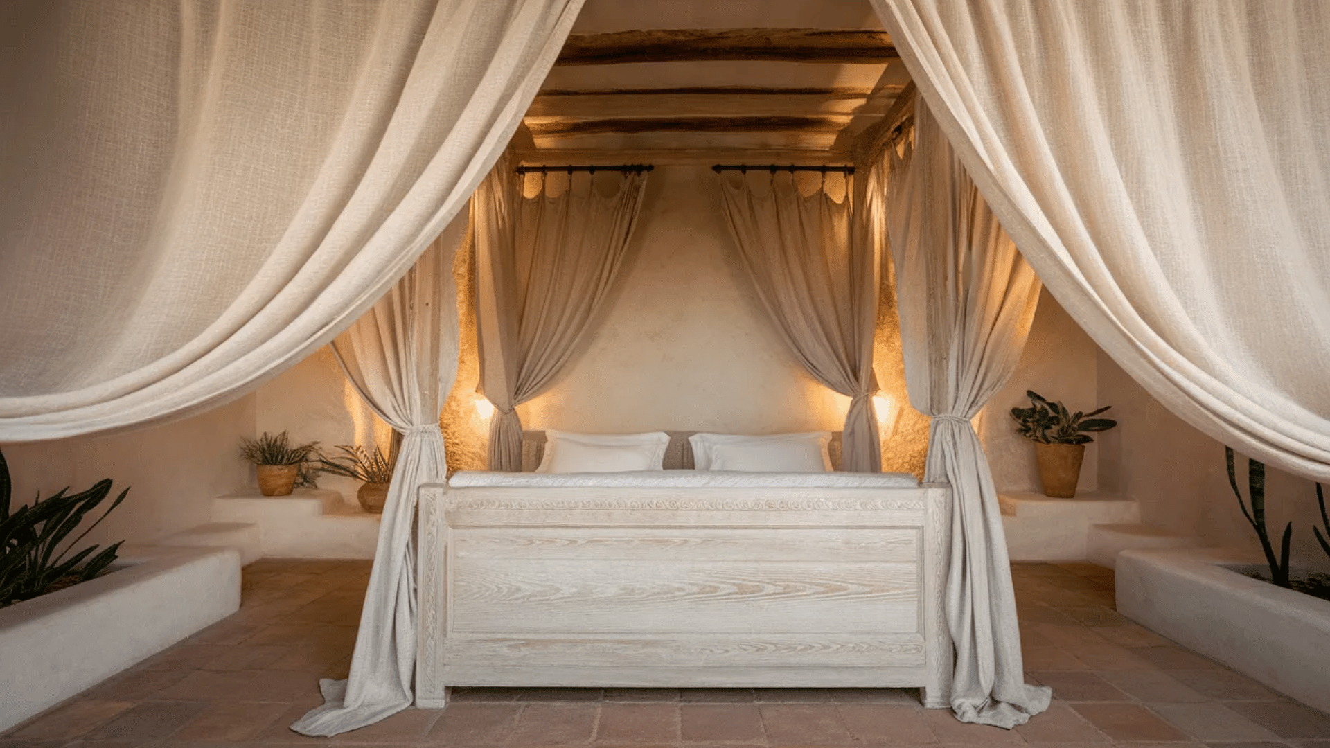 bedroom with soft, flowing curtains and rustic wood furniture