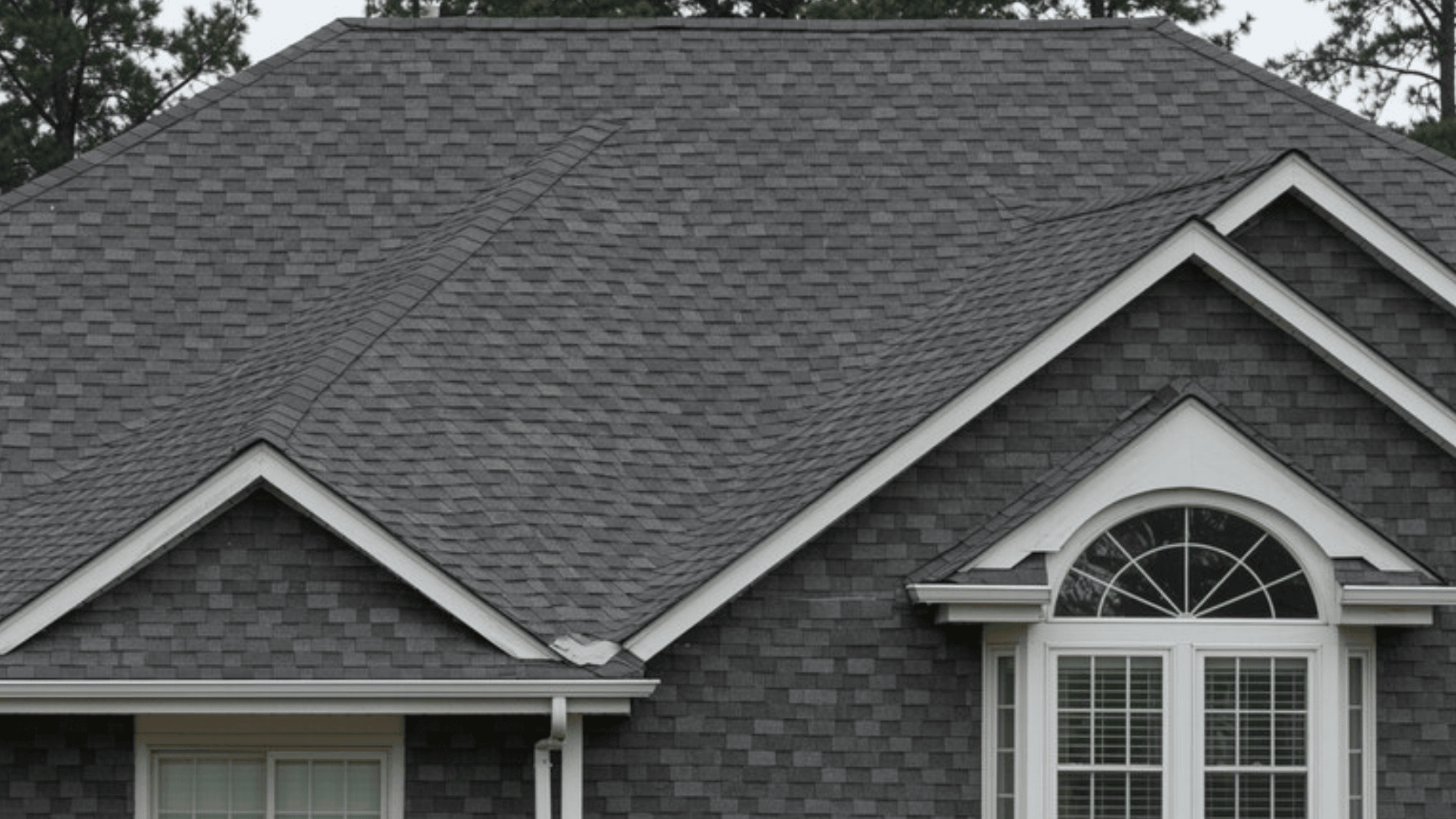 detailed view of roof shingles and house, crisp overlapping shingle patterns, whole house included