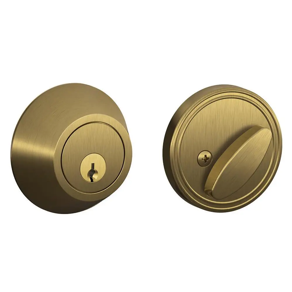 Brass deadbolt lock set with keyhole and thumb turn on white background