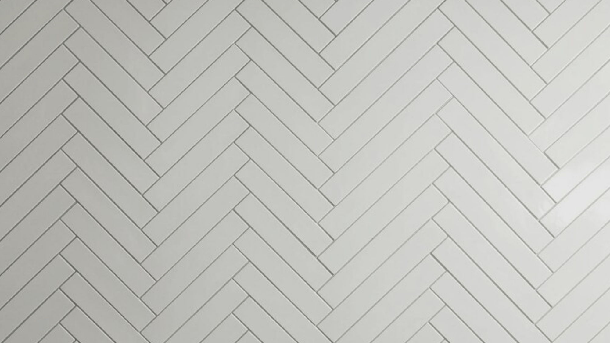 herringbone tiles, contrasting black grout accentuating geometric 45-degree V-pattern