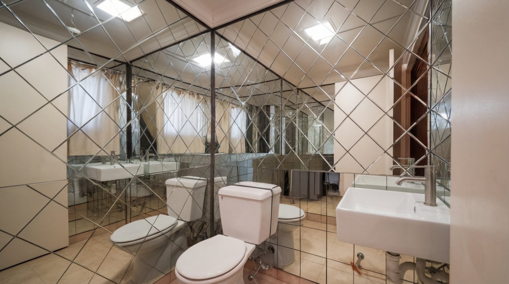 mirror wainscoting in a small washroom