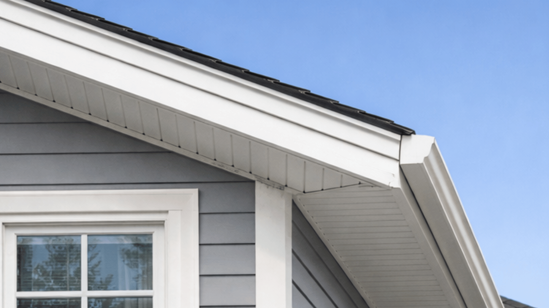 modern colonial house with neatly enclosed eaves, offering a clean, smooth appearance.