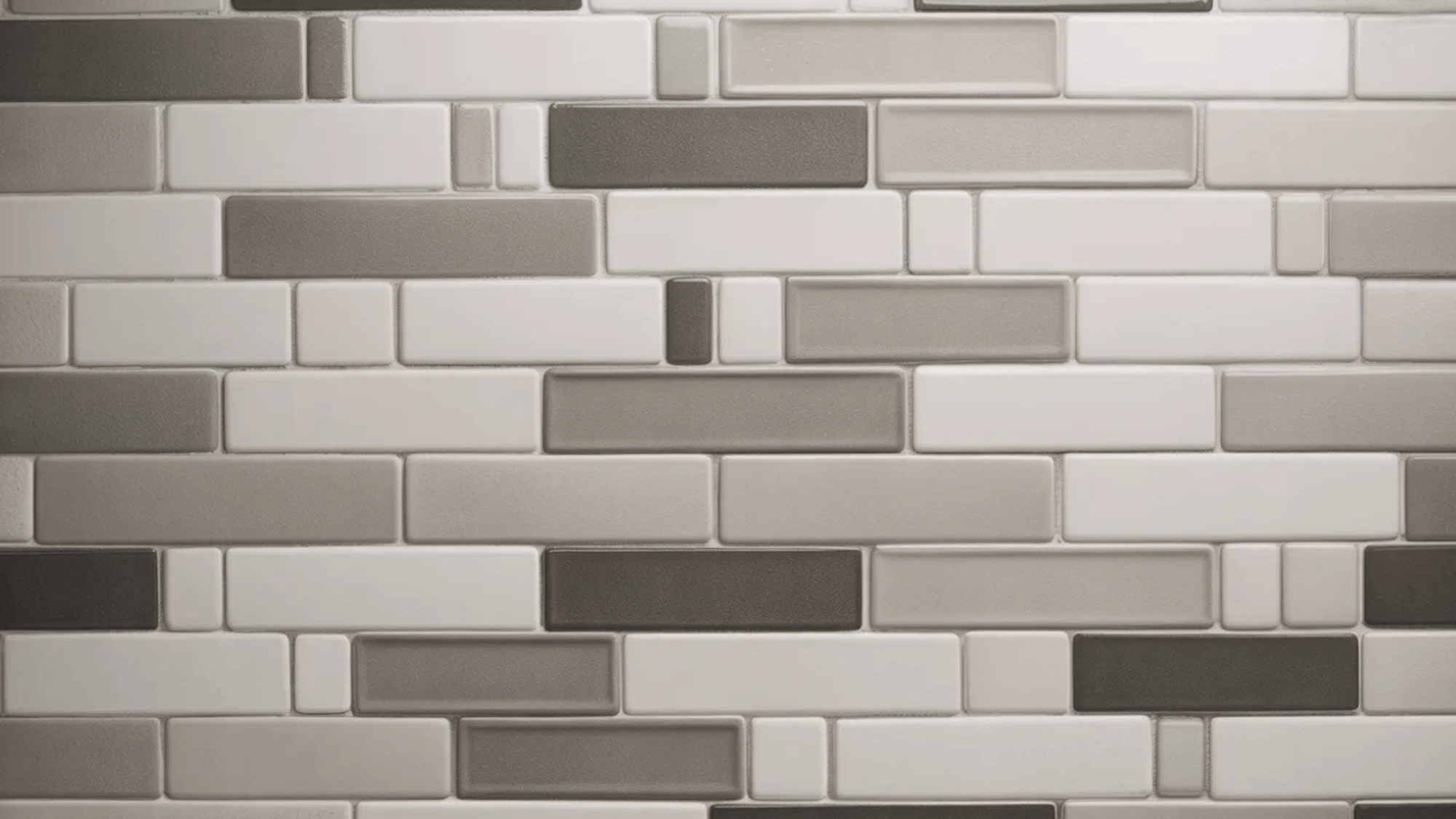 neutral-colored rectangular tiles arranged in a random pattern