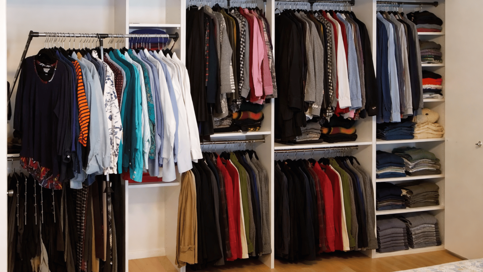 pull-down clothing rods in a high-ceiling closet for easy access to long garments and coats