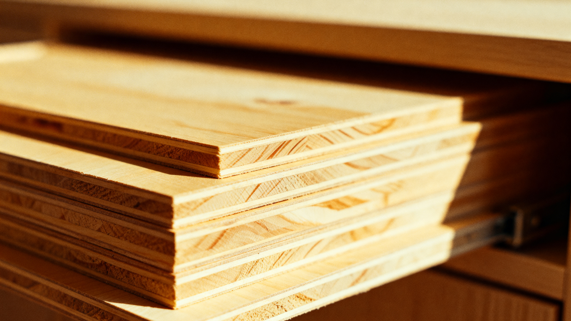 stacked sheets of Baltic birch plywood showing smooth surfaces and layered edges, highlighting its strength, stability, and clean finish for cabinetry and shelving