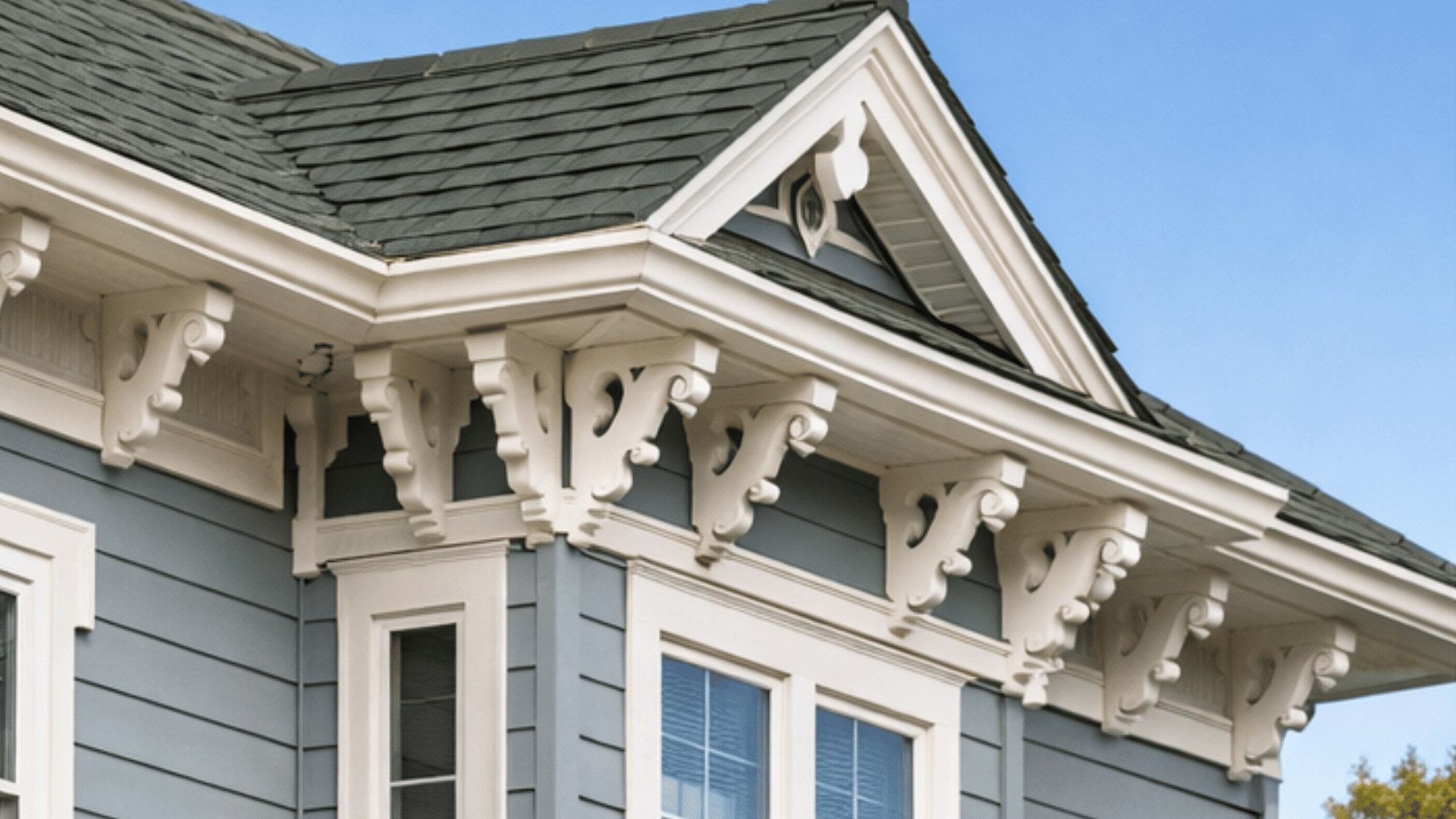 victorian or cottage-style home with intricate brackets, corbels, and moldings