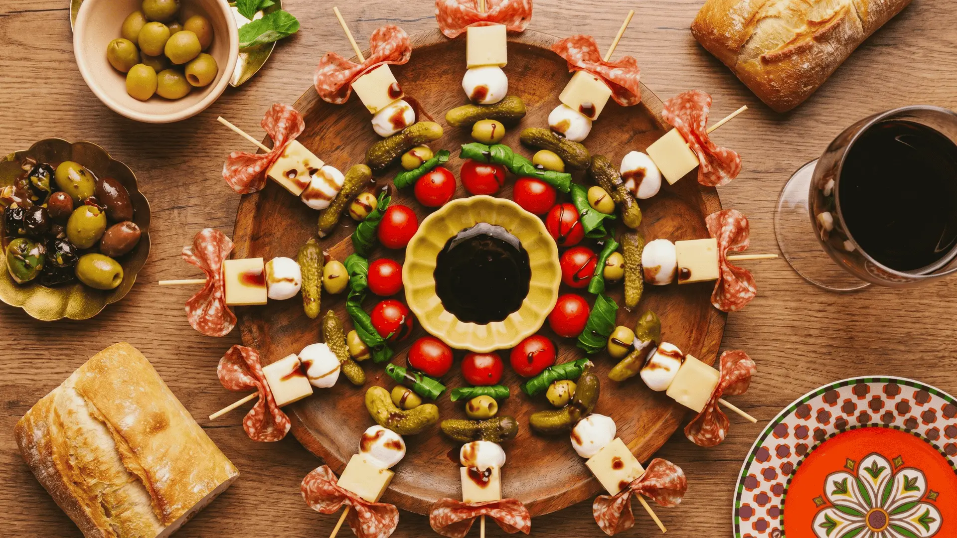 A board with bite-sized snacks and a few dips arranged for easy grabbing at gatherings.