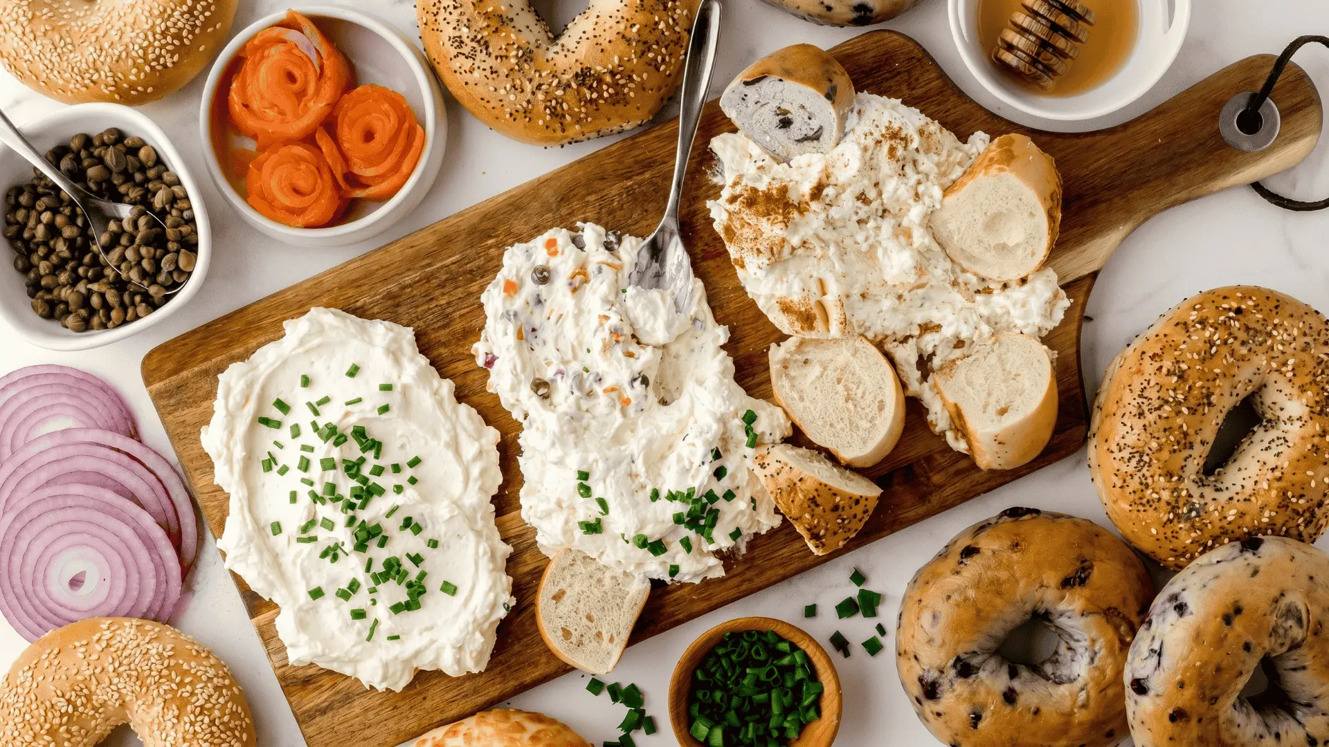 A board with soft cheese, spreads, dips, and bread or crackers arranged neatly for a smooth and easy-to-eat setup.