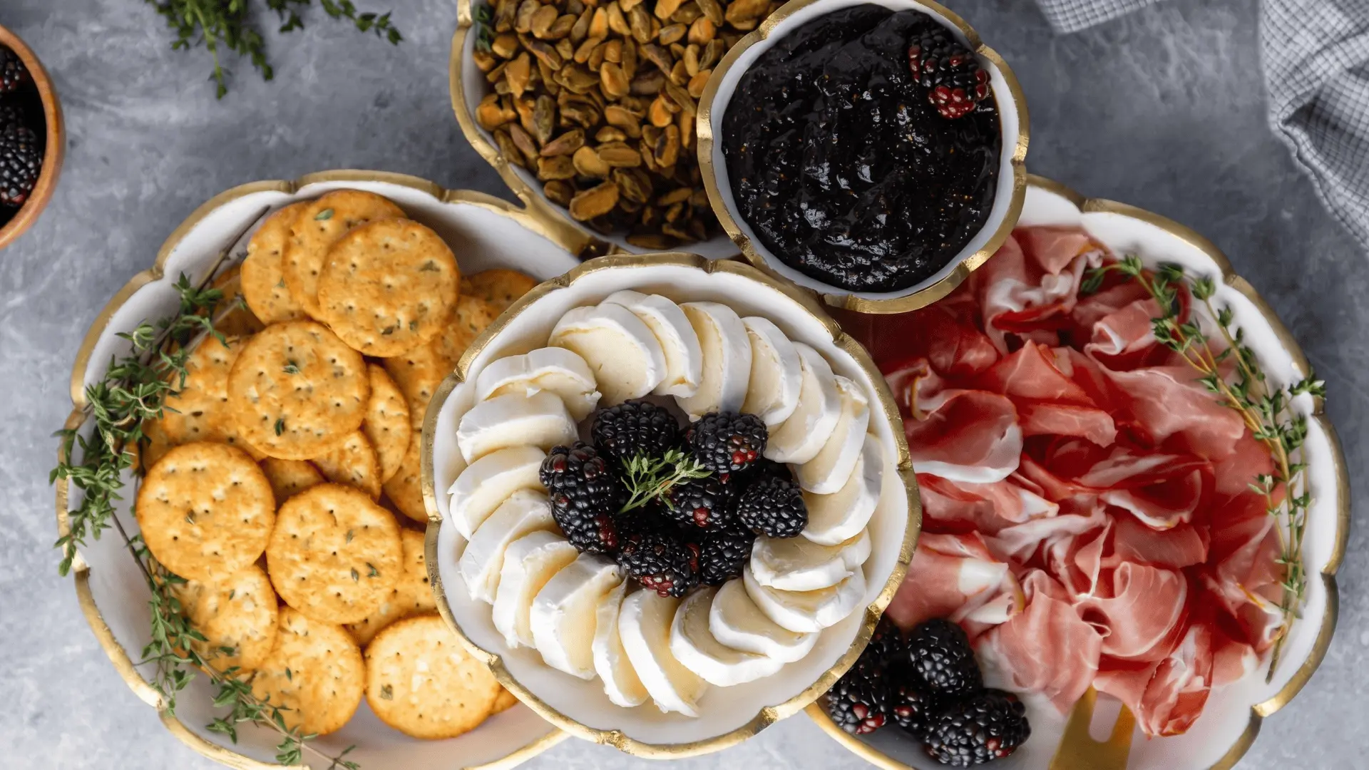 A customizable board with snacks, dips, and spreads in separate bowls for easy mixing and matching.