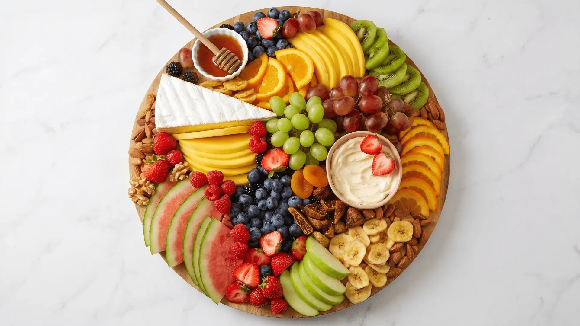 A fruit board with a variety of fresh, colorful fruits and a simple dip like yogurt or chocolate arranged neatly.