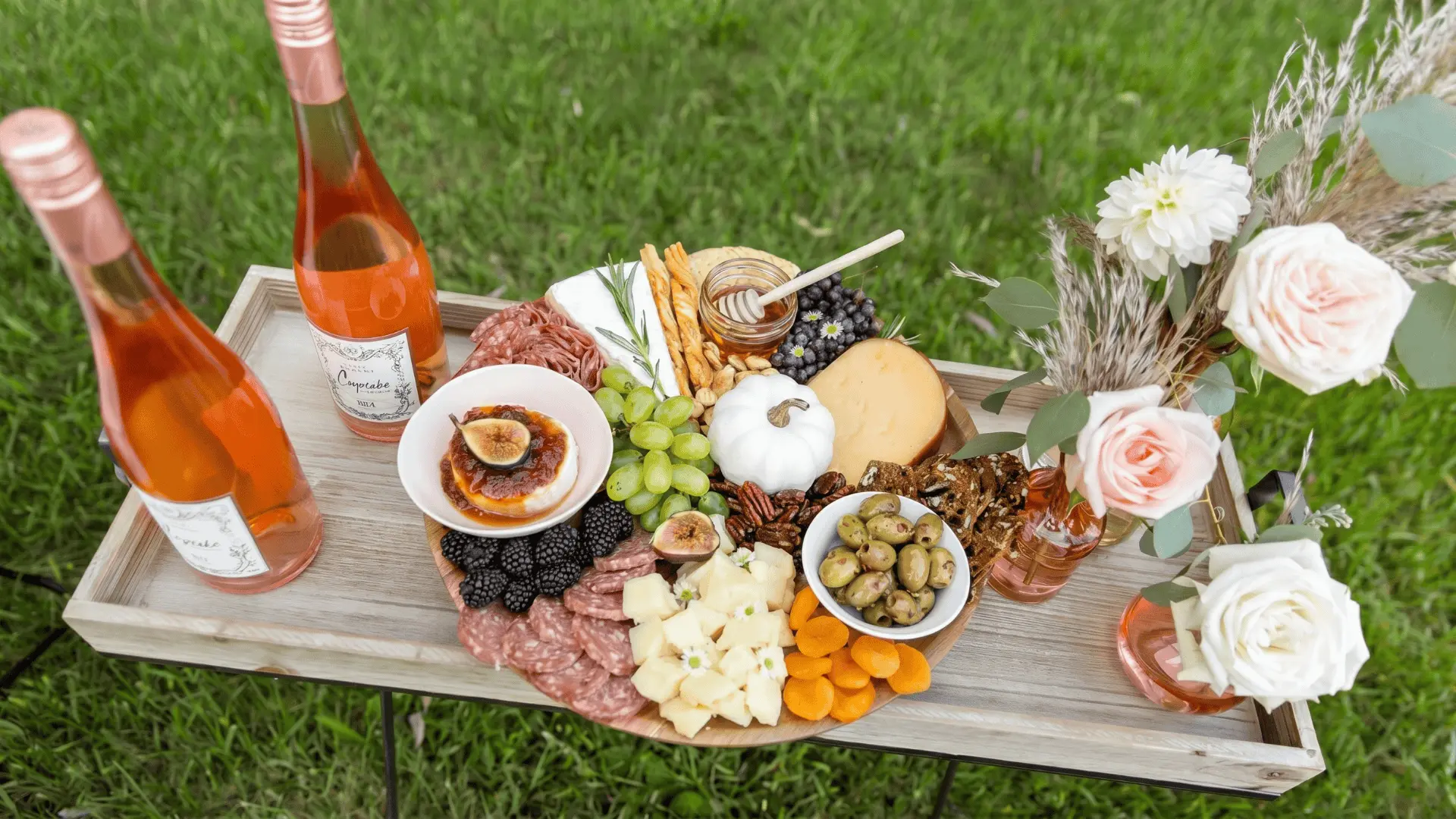 A seasonal board with apples, nuts, and baked snacks, arranged in layers with warm-toned dips for a cozy autumn feel.