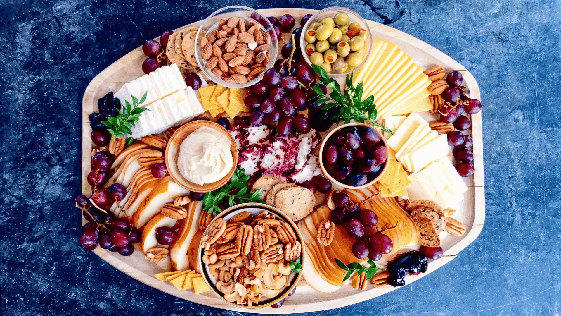 A simple meal board with bread, vegetables, light protein, and dips arranged neatly for a balanced midday meal.