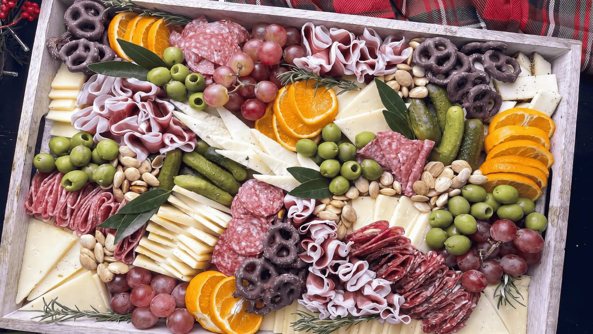 A themed snack board with foods and sweets chosen in matching holiday colors, styled with simple decorative touches for a festive presentation.